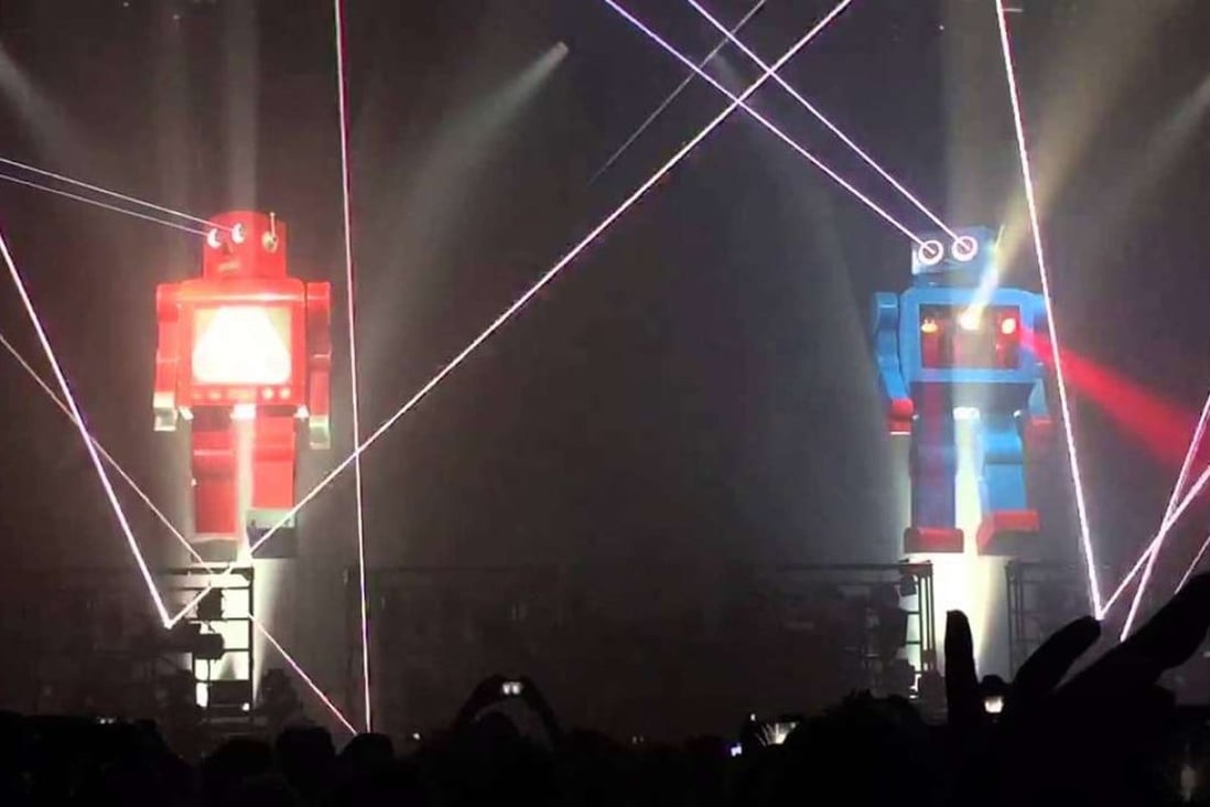 Giant robots on stage at a Chemical Brothers show.