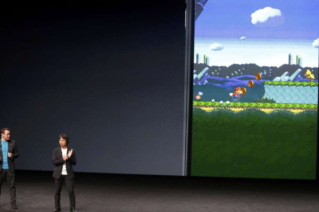 Nintendo’s Shigeru Miyamoto (right) announces Super Mario Run, a mobile game available exclusively for iOS, at Apple’s iPhone 7 media event in San Francisco on September 7. Photo: Reuters
