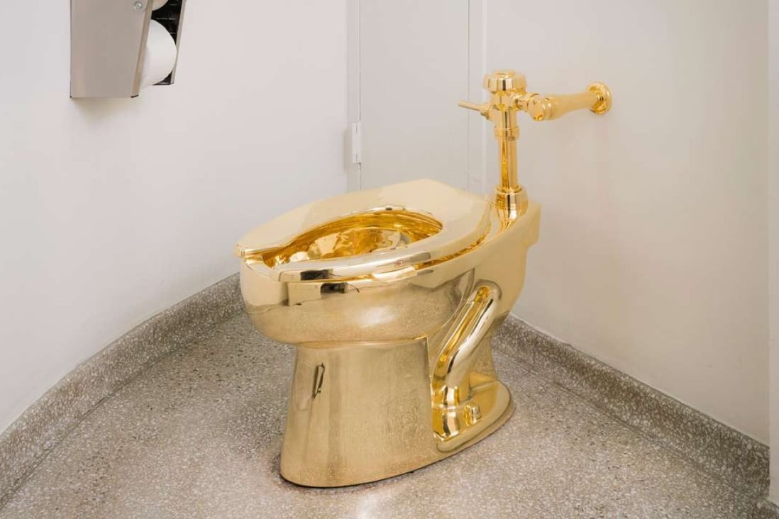America, the art installation by Italian Maurizio Cattelan that’s a working toilet in solid gold and available for the use of the visitors to the Guggenheim museum in New York. Photo: Kristopher McKay/Solomon R. Guggenheim Museum