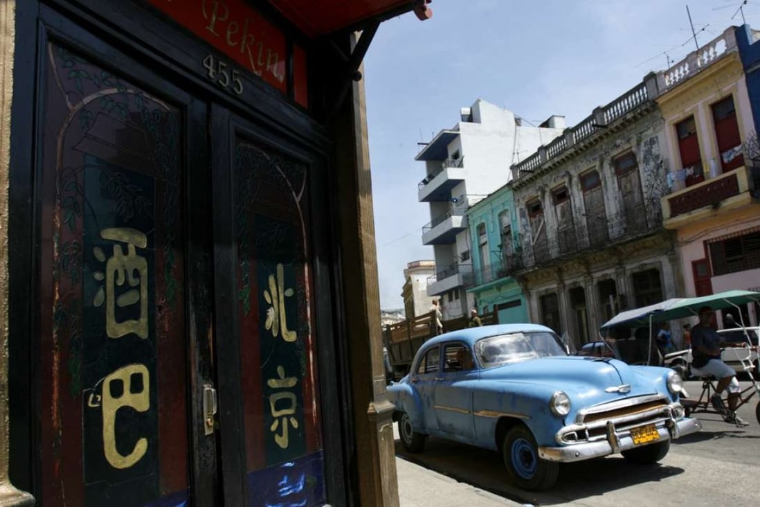 A vintage car is parked outside a Chinese restaurant in Havana’s Chinatown. Photo: Reuters
