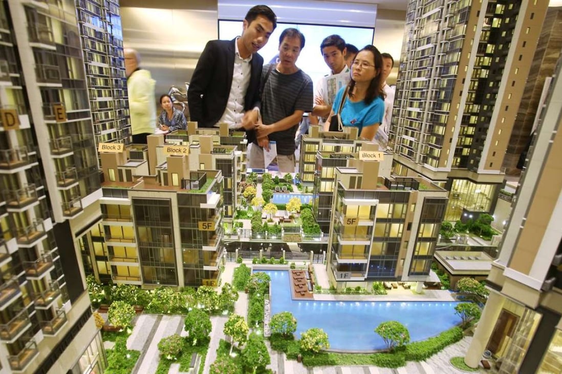 Potential buyers visit a sales office for a new development last month. A commentary in People’s Daily endorsed hard work as more important than property speculation. Photo: Dickson Lee