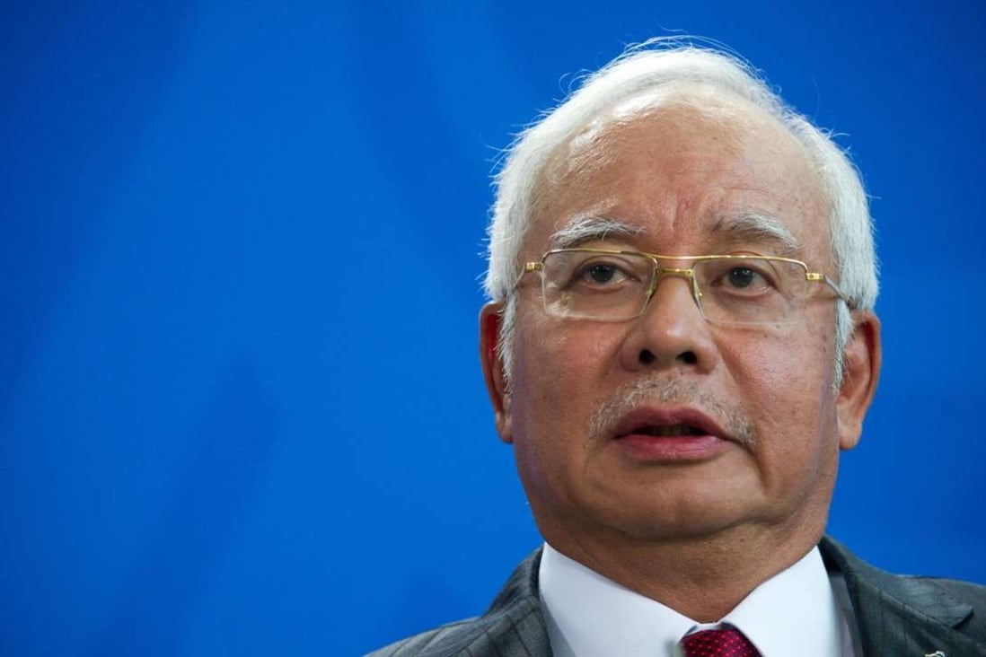 Malaysian Prime Minister Najib Razak speaks to the media during a joint news conference with German Chancellor Angela Merkel. Photo: EPA