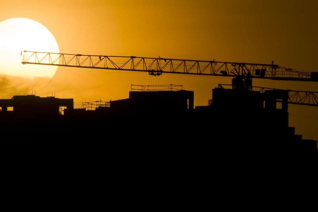 The sun sets over a construction site in Singapore's Punggol area. Photo: Xinhua