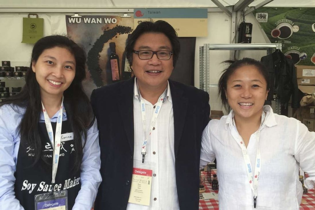 Slow Food Great China co-founder Ling Kuang Sung (centre) with delegates from the Taiwan stand at the Terra Madre food festival in Italy. Photo courtesy of Slow Food Terra Madre