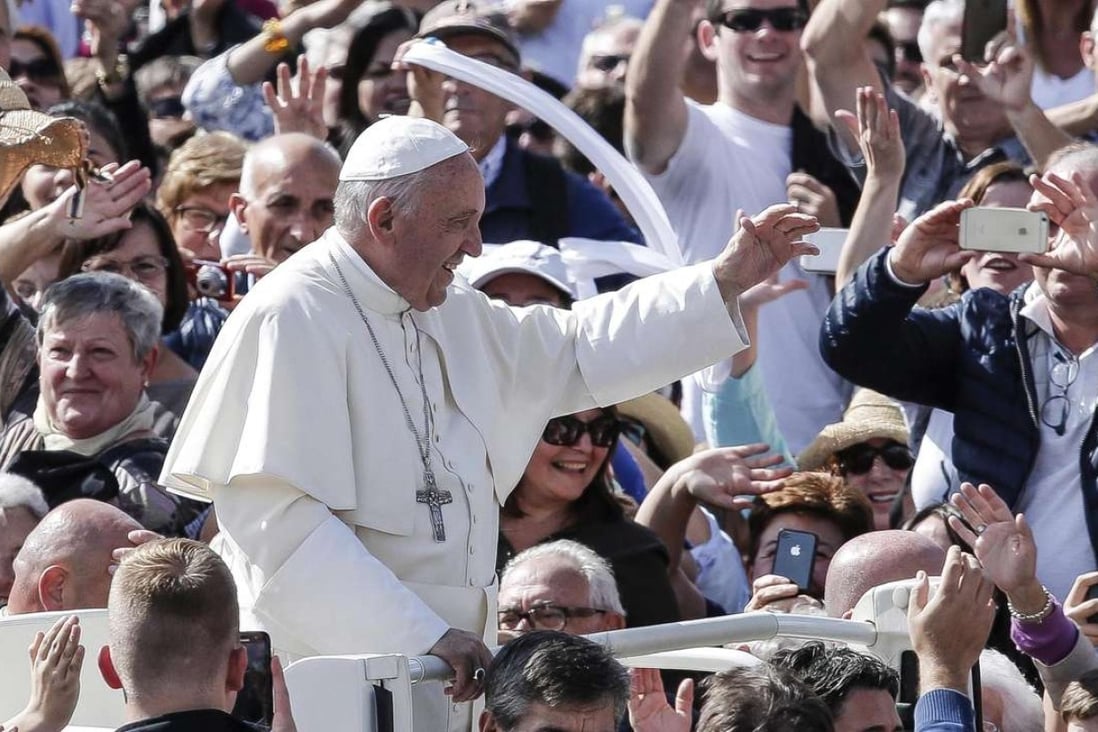 Pope Francis greets the Catholic faithful after he celebrates a jubilee mass in St Peter's Square at the Vatican on Sunday. Photo: EPA