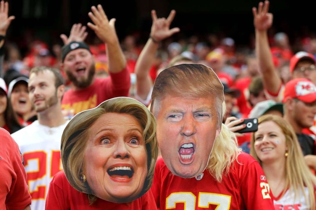 KANSAS CITY, MO - SEPTEMBER 25: Kansas City Chiefs fans wear Hillary Clinton and Donald Trump masks during the game bethween the Chiefs and the New York Jets at Arrowhead Stadium on September 25, 2016 in Kansas City, Missouri. Jamie Squire/Getty Images/AFP == FOR NEWSPAPERS, INTERNET, TELCOS & TELEVISION USE ONLY ==