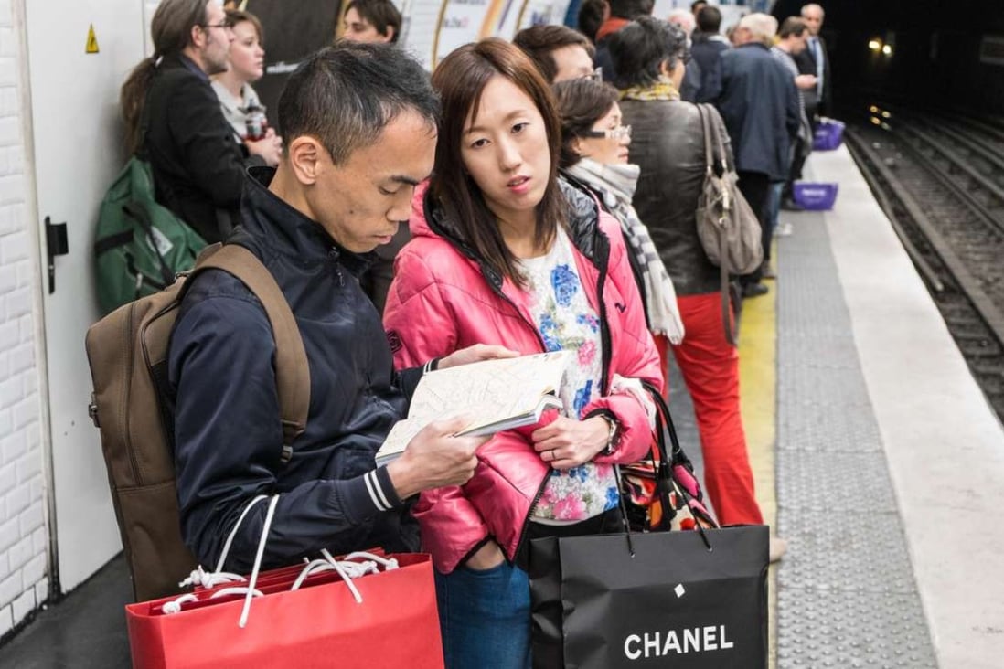 Chinese tourists laden with shopping bags in Paris. Photo: SCMP