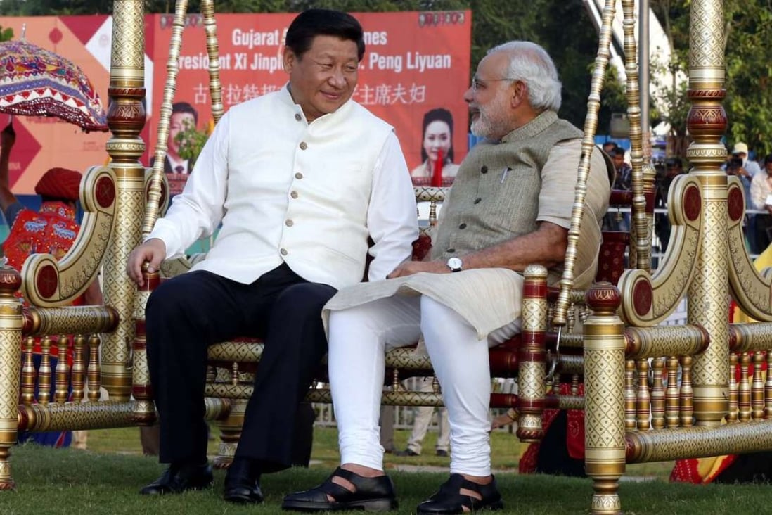 Chinese President Xi Jinping sits on a swing with Indian Prime Minister Narendra Modi at a riverside park in Gujarat in 2014. Photo: Xinhua