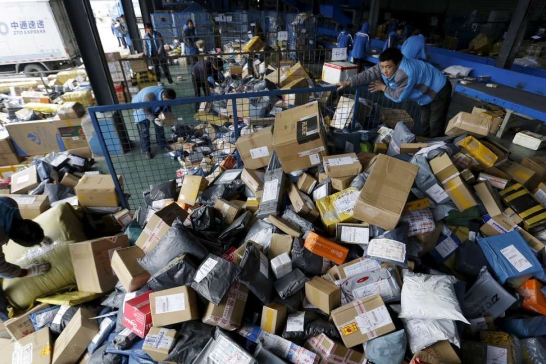 Employees work at a sorting centre of Zhongtong (ZTO) Express ahead of the Singles Day shopping festival in Beijing on November 8, 2015. Photo: Reuters