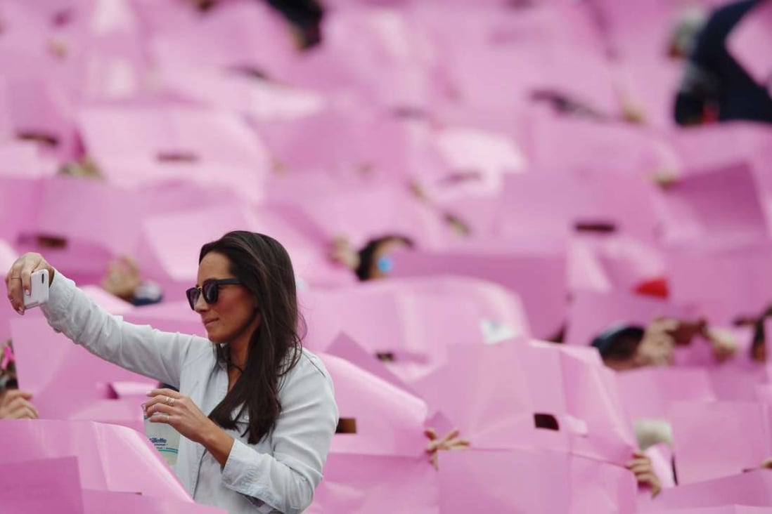People in Gillette Stadium, in Foxboro, Massachusetts, mark breast cancer awareness month during a football game. With the advent of social media, there is a perception at times that the disease has been tamed. Photo: EPA