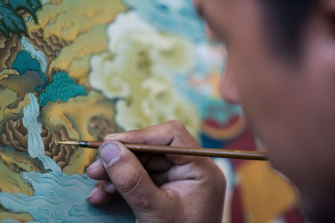 A student painting a thangka at the Danba Raodan art school in Lhasa. Tibet’s traditional religious art is undergoing a revival, driven in part by Chinese collectors. Photo: AFP