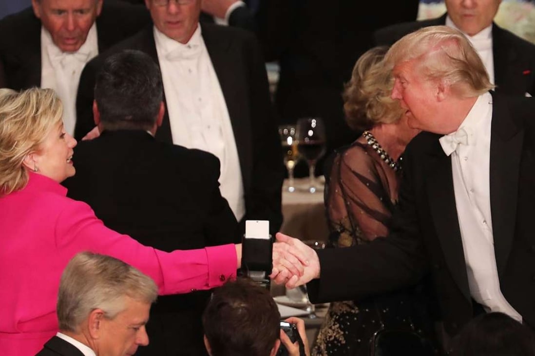 Hillary Clinton and Donald Trump shake hands at the Alfred E. Smith Memorial Foundation dinner in New York. Photo: AFP