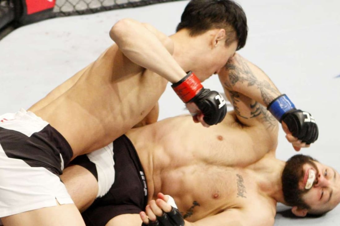 Choi Doo-ho pounds Sam Sicilia of the United States in a featherweight bout in Seoul. Photo: Getty Images
