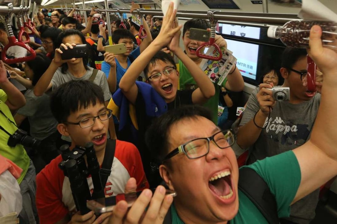 Some commuters were very happy to be on the first train from Whampoa. Photo: Sam Tsang