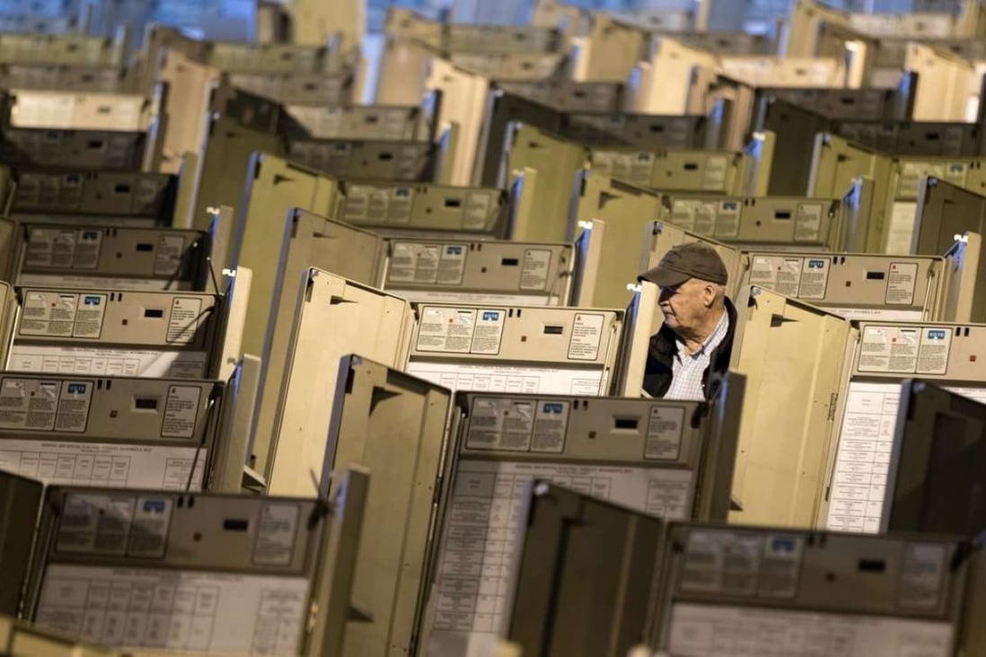 A technician works to prepare voting machines to be used in the upcoming presidential election in Philadelphia. Pennsylvania could be a key battleground state in the election, but the state still employs 1980s-era voting machines. Photo: AP