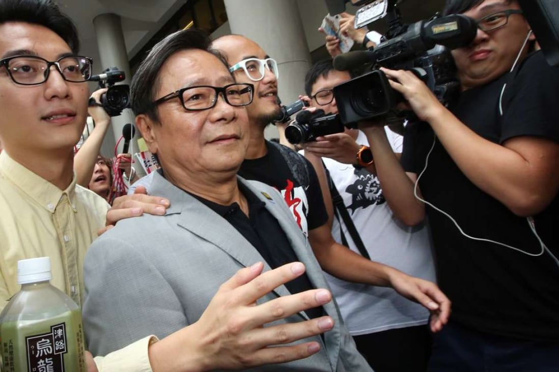 Former lawmaker Wong Yuk-man (centre) leaves Eastern Court. Photo: David Wong