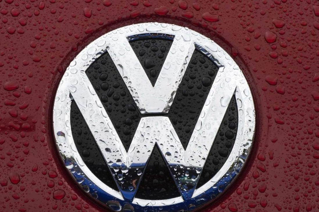 The VW emblem is seen on a Volkswagen for sale at a dealership in Gaithersburg, Maryland. A US judge on October 25, 2016 granted final approval for a $14.7 billion class action settlement in Volkswagen's diesel emissions cheating scandal. Photo: AFP