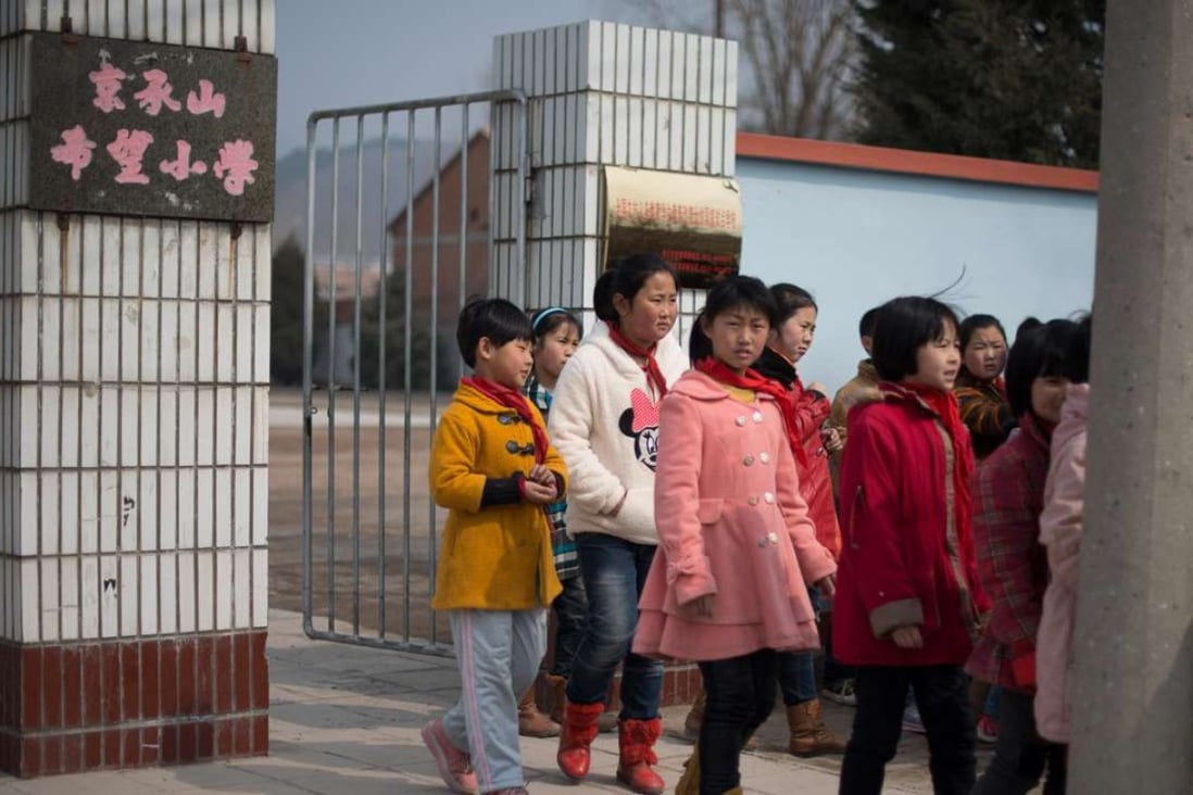 Children leaving a school in Chengde, Hebei province. China has a large gap in educational attainment between males and females. Photo: AFP