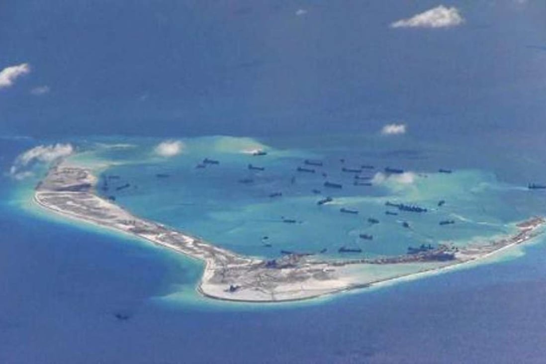 A picture taken by the US Navy of dredging work carried out by Chinese vessels on Mischief Reef in the Spratly Islands last year. Photo: Reuters