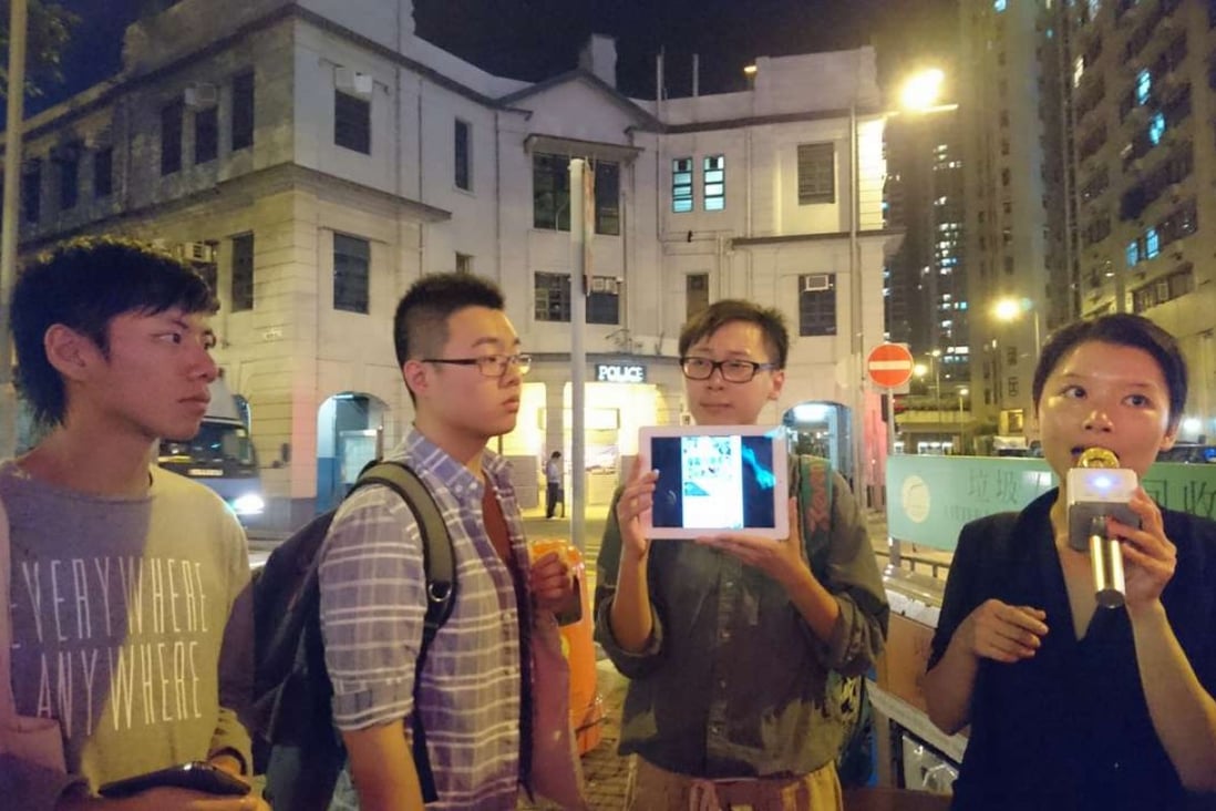 On the 20,000 Ways to Die in Yau Ma Tei tour are Ben Lam (left), Chris Ko and Holok Chan of the Student Christian Movement of Hong Kong, and Melody Chan, the guide.