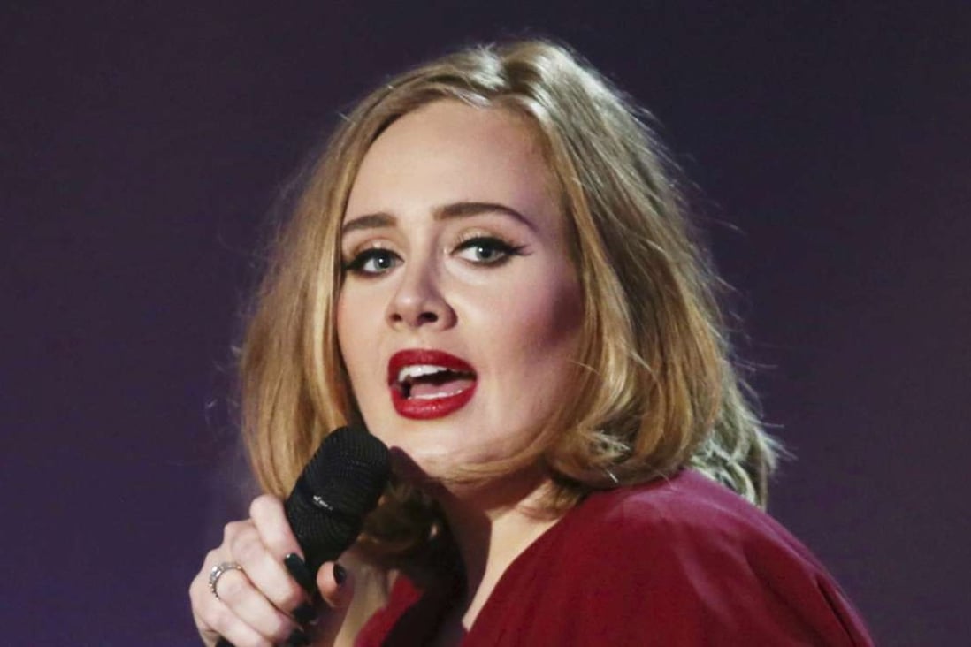 Adele onstage at the Brit Awards 2016 at the 02 Arena in London. Adele opened up to Vanity Fair about parenting and her struggle with postpartum depression in an issue for the magazine's December 2016 issue. Photo: AP