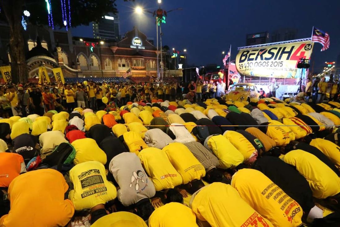 Malaysian Muslims pray during the protest rally by electoral concern group Bersih last year. The release of the emails comes ahead of another rally planned by the group this month. Photo: AFP