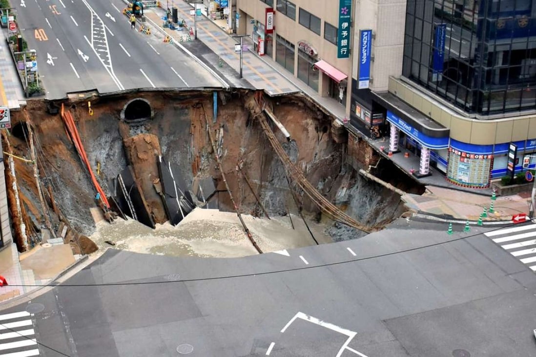 giant-sinkhole-swallows-large-chunk-of-busy-street-in-japanese-city