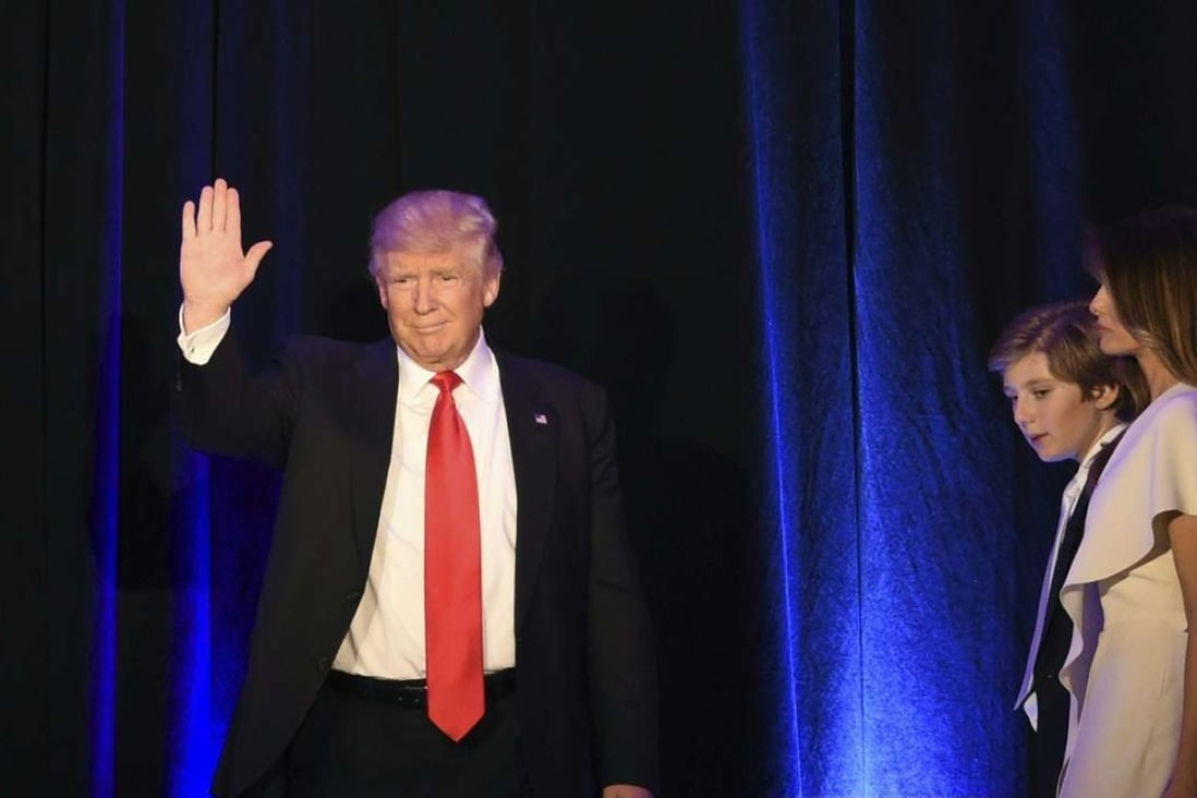 Republican presidential candidate Donald Trump waves from the balcony flanked by members of his family shortly before addressing supporters at the New York Hilton Midtown. Photo: AFP