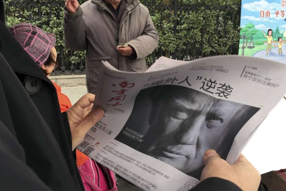 A Chinese newspaper in Beijing on November 10 features a front page photo of US President-elect Donald Trump under a headline that translates as "Outsider counter attack". Photo: AP