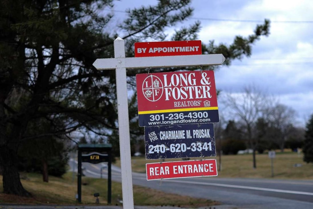 A for sale sign seen in front of a house in Silver Spring, Maryland, as US sales of existing homes rose in October at the highest annual pace in nearly a decade. Photo: AFP