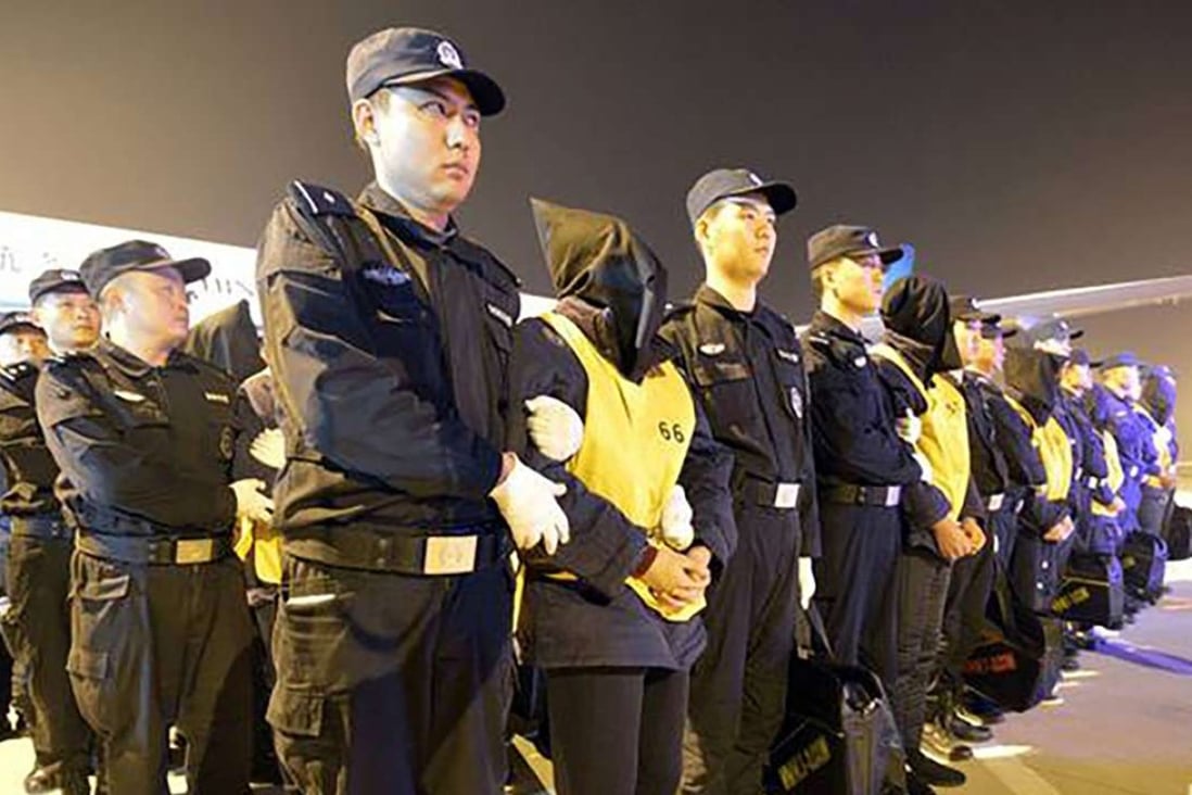Fraud suspects pictured at Wuhan airport after they were deported from Malaysia. Photo: SCMP Pictures