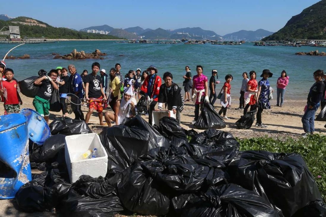 The Japanese tourists clean up Lo So Shing village beach on Lamma Island. Photo: K. Y. Cheng