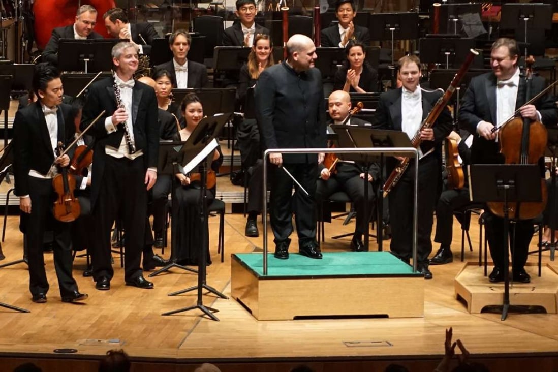 Soloists Jing Wang (violin), Michael Wilson (oboe), Benjamin Moermond (bassoon) and Richard Bamping (cello) stand as the Hong Kong Philharmonic receives applause for its performance of Haydn's Sinfonia Concertante. Photo: Cheung Wai-lok