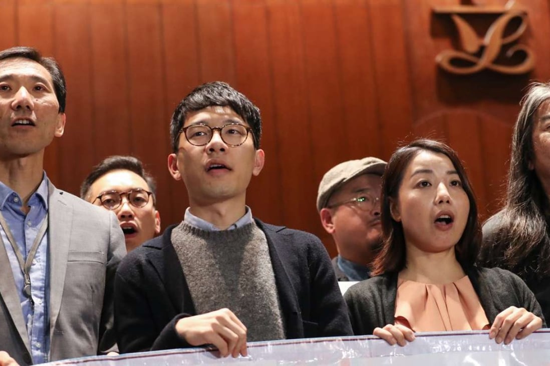 Lawmakers (from left) Edward Yiu, Nathan Law, Lau Siu-lai and Leung Kwok-hung protest against Chief Executive Leung Chun-ying outside the Legislative Council on December 2 after the government filed judicial writs to disqualify them over improper oath-taking. Photo: Nora Tam