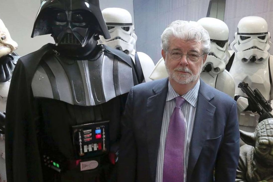 George Lucas with Darth Vader, Yoda and stormtroopers.