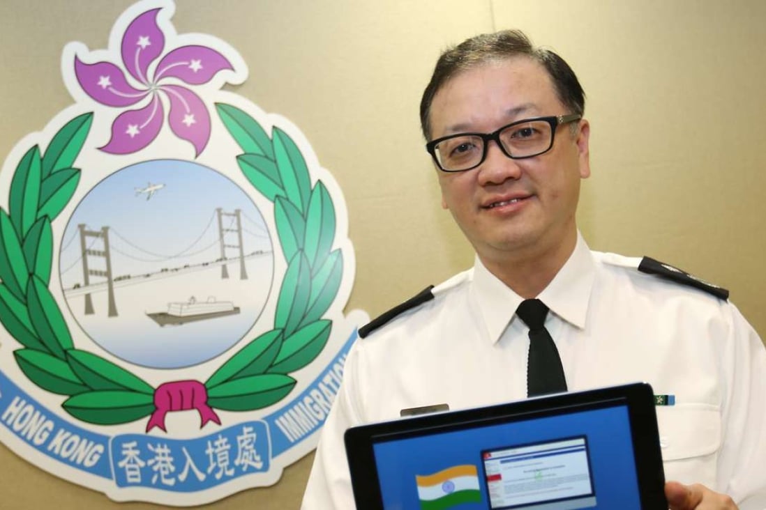 Immigration official Ma Chi-ming showing an online registration screen in Wan Chai on Thursday. Photo: Xiaomei Chen
