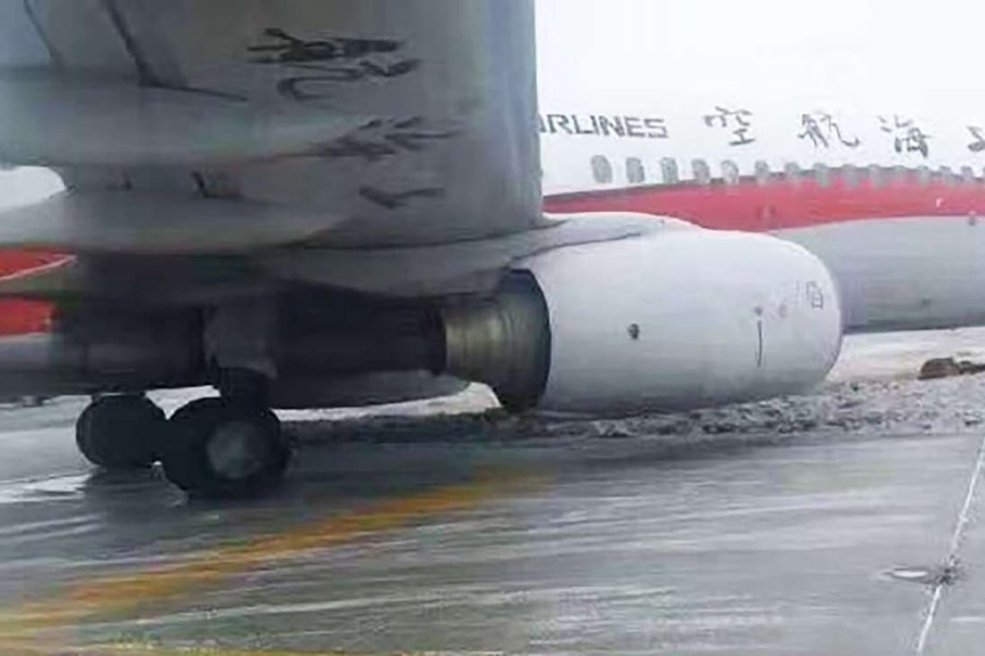 A Shanghai Airlines passenger plane slid off the icy taxiway at Urumqi Diwobao International Airport in Xinjiang just before take-off. Photo: Weibo