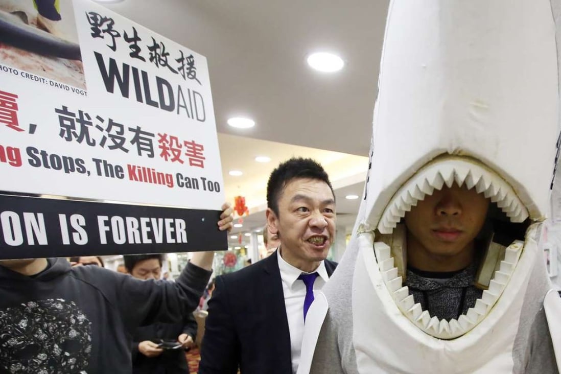 Protesters target a restaurant in North Point that offers shark fin on the menu. Photo: Sam Tsang