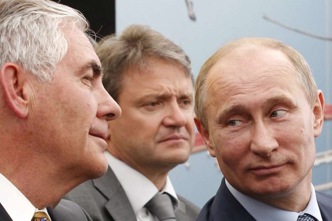 ExxonMobil chief executive Rex Tillerson (left) and Russian President Vladimir Putin (right) attend a signing ceremony in Tuapse, Russia, in June 2012 for an agreement between Rosneft and ExxonMobil to jointly develop reserves in western Siberia. Photo: EPA/Mikhail Klimentyev/RIA Novosti