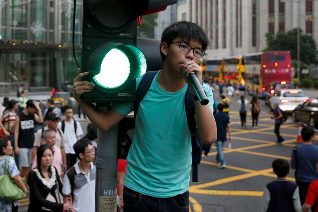 Pro-democracy activist Joshua Wong believes it is “extremely unreasonable” for the Singapore police to require a talk’s organiser to apply for a work permit for a speaker like him to speak through Skype. Photo: Reuters