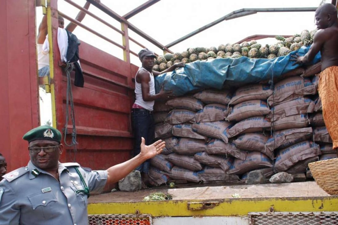Nigerian customs officials confiscated tonnes of fake rice in Lagos on Wednesday. Photo: EPA