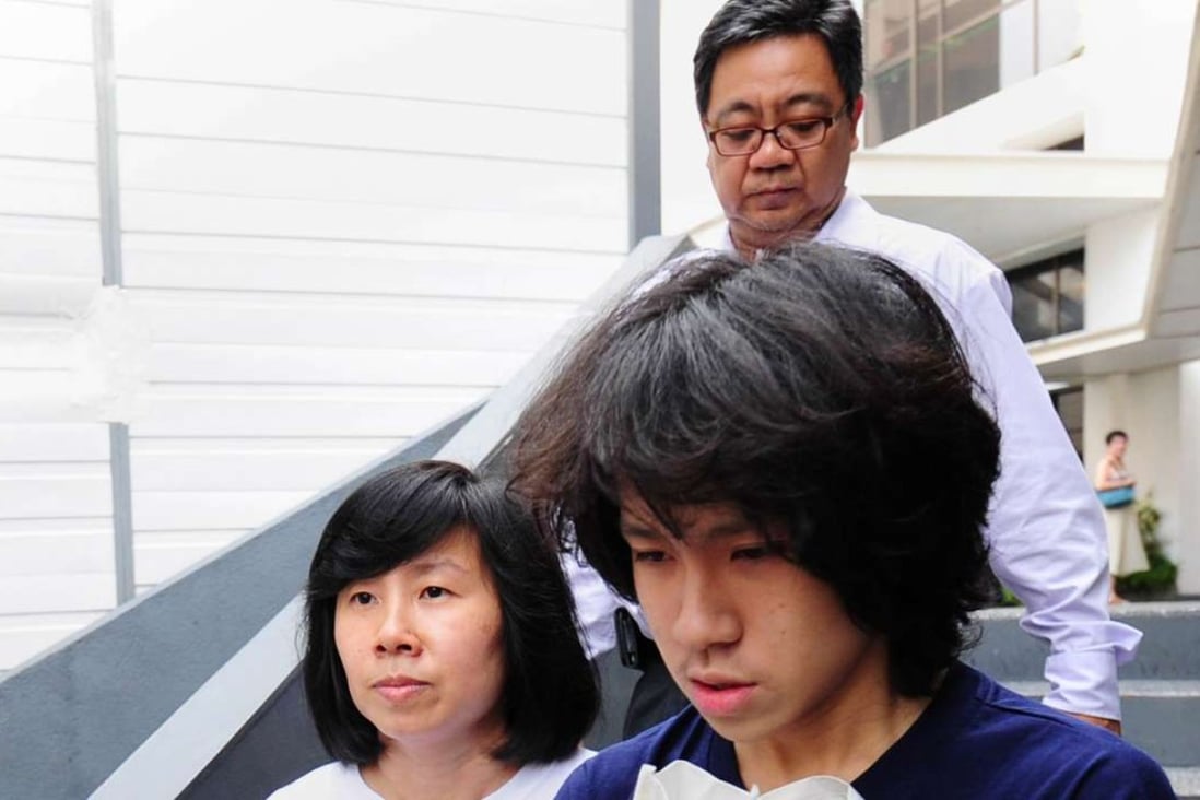 Teenage blogger Amos Yee leaves court with his parents in Singapore after sentencing last year. Photo: AFP