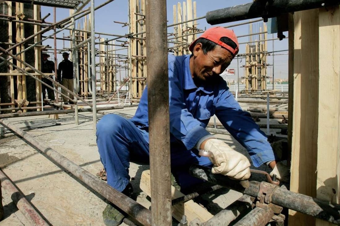 A Chinese worker fixes pipes at a construction site in Sudan’s capital Khartoum in February 2012. China is a major funder of infrastructure projects in Africa. Photo: AFP