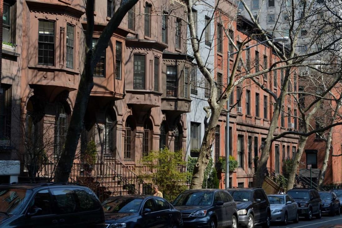 Brownstone residences on East 91st Street on the Upper East Side of Manhattan. Luxury transactions across all property types have fallen sharply in Manhattan. Photo: AFP