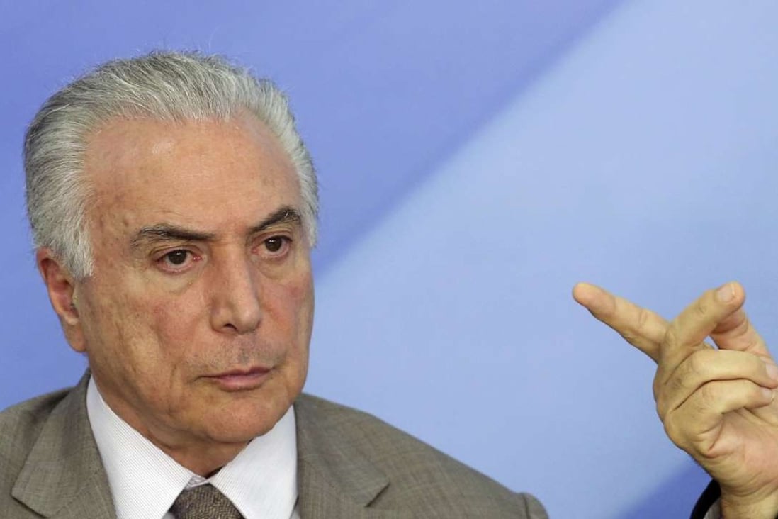 Brazil's President Michel Temer attends a press conference on new measures to stimulate the economy, at Planalto presidential palace, in Brasilia. Photo: AP