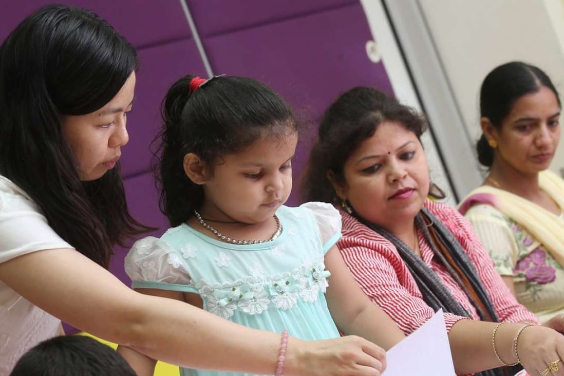 Parents learn Chinese with their children under a Jockey Club language programme at the HKSPC Children & Family Services Centre in Kowloon City. Photo: K.Y. Cheng