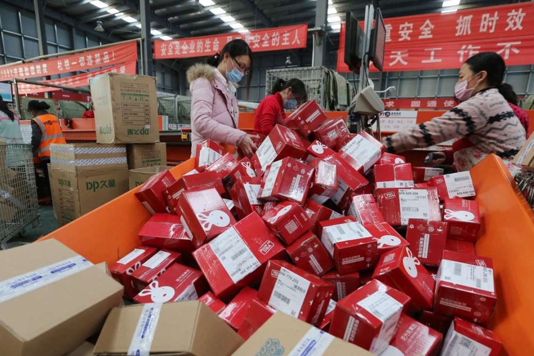Workers packaging goods for delivery at a sorting centre in Lianyungang, Jiangsu province, during the Singles’ Day online shopping festival on November 11, 2016. Photo: AFP