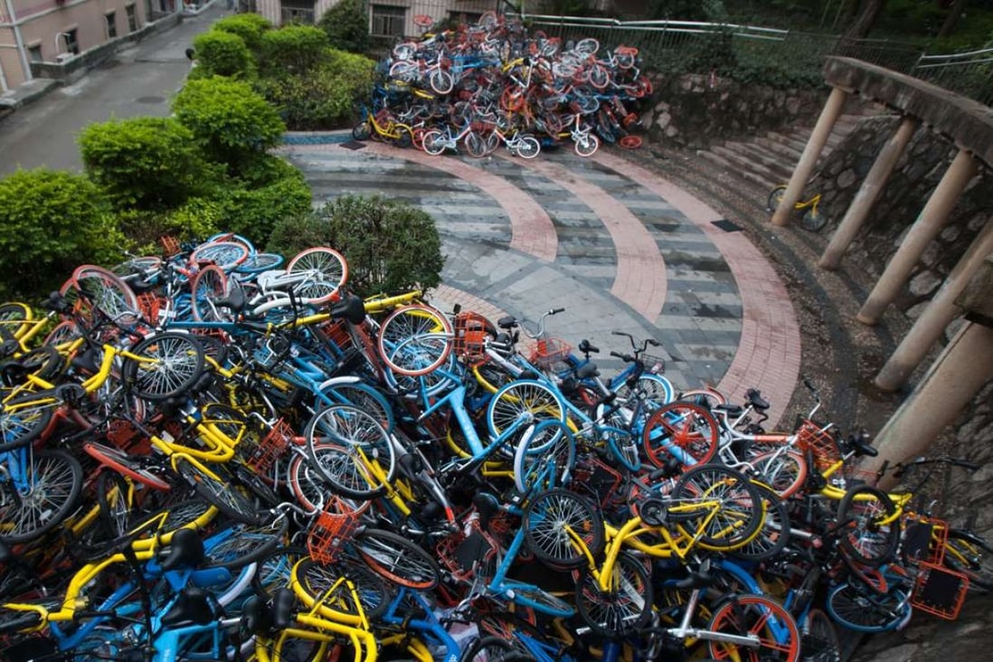 The rent bicycles, many of them vandalised, have been left piled up near Xiashan Park, in Shenzhen. Photo Imaginechina