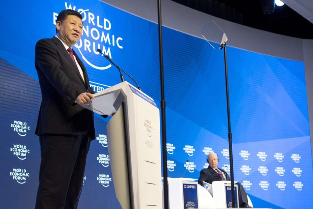 Chinese President Xi Jinping addresses the World Economic Forum on Tuesday. Photo: EPA