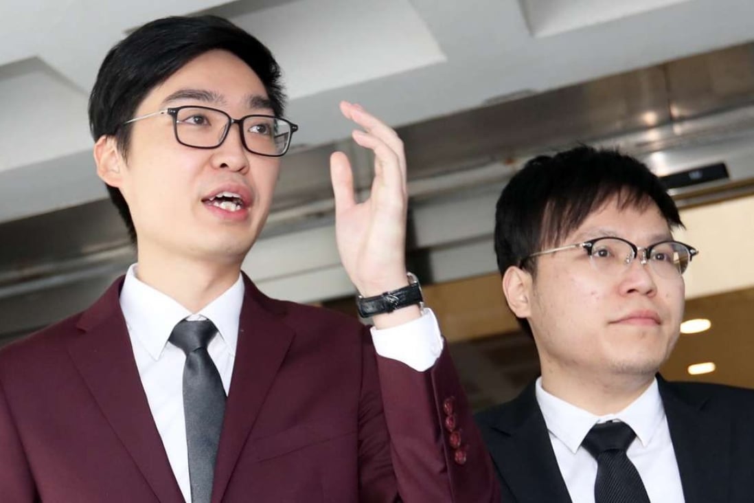 Hong Kong National Party convenor Andy Chan (left) with colleague Jason Chow outside the High Court on Thursday. Photo: Edward Wong